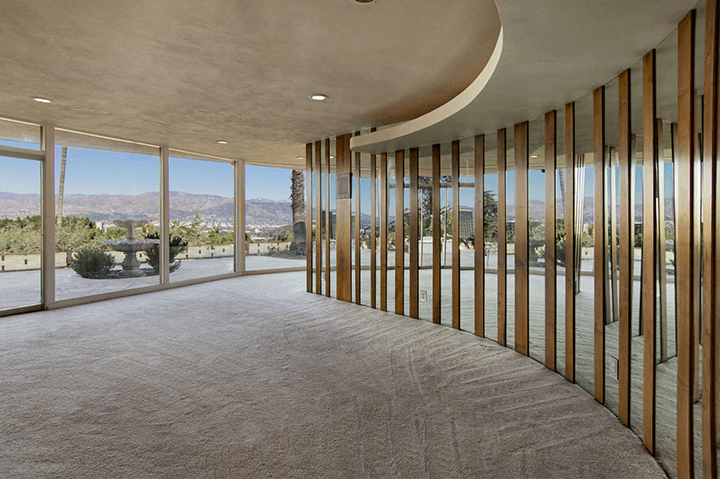 Mid-century fixer with curvaceous living room seeks $1.4M