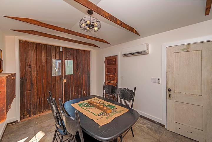 The dining area and AC, wooden door