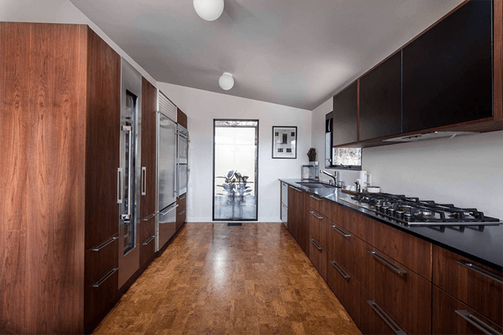 The kitchen of Mid-century Modern Architecture Sunset Strip with wooden shelves, racks, and cabinets around