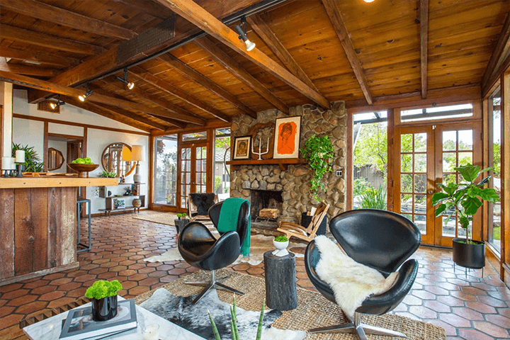 The living room and a fireplace of the Cottage in Hollywood Hills