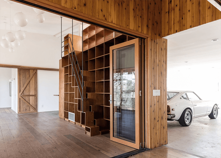 The car and shelf are features of the unique modern house rental located in Echo Park
