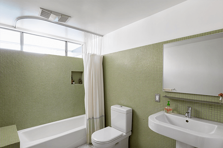 Bathroom and bathtub with small tiles