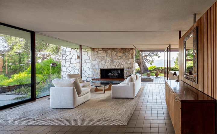 The living room of 1953 Case Study House no 16 Bel Air CA and a fireplace