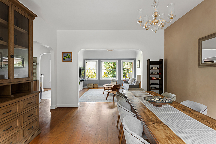 Dining place and living room with wooden floor in Dutch Colonial style in Silver Lake