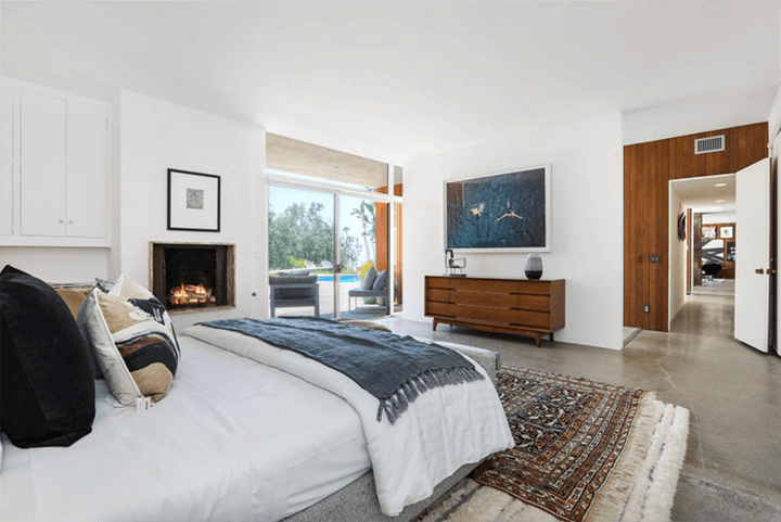 Large bedroom with view of swimming pool