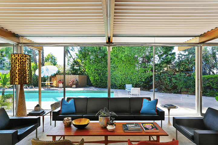 The living room of Grossman House by Raphael Soriano with a view of the swimming pool