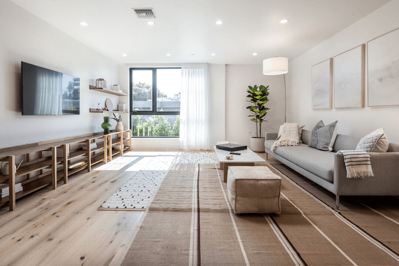 Inside the minimalist interior of Etco Homes with a window strategically placed to bring in natural light.