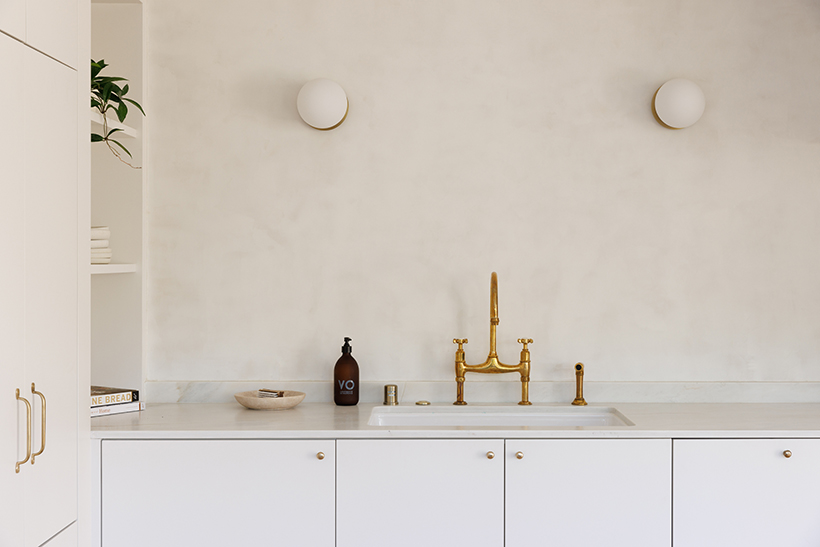 Blush gold basin with white tiles