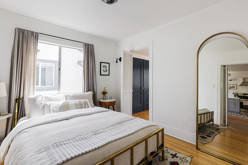Bedroom with mirror of Spanish-style TIC in Echo Park